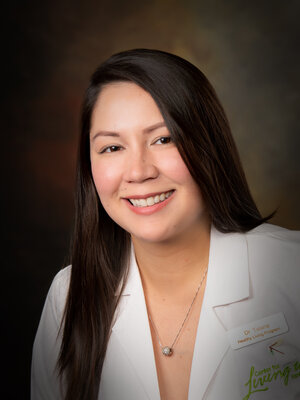Headshot of Amy Shook Talana, a female healthcare provider wearing a white lab coat