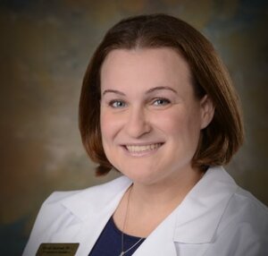 Headshot of Sarah Sumrall, board-certified Physician Assistant provider at the Center for Living. Well - Epcot, wearing a white lab coat