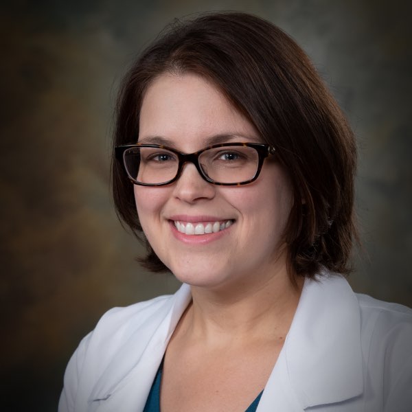 Headshot of Angela Bray, a female healthcare provider wearing a white lab coat