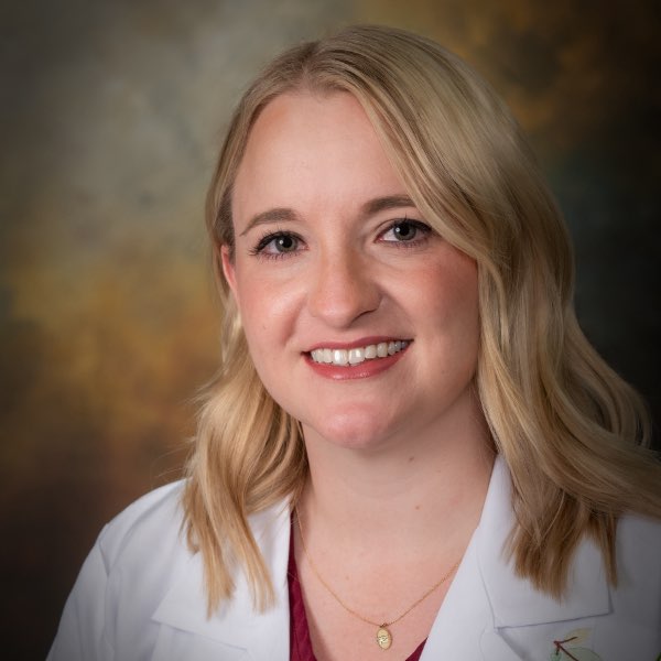 Headshot of Haley Lang, pharmacist for the Center for Living Well - Epcot, wearing a white lab coat